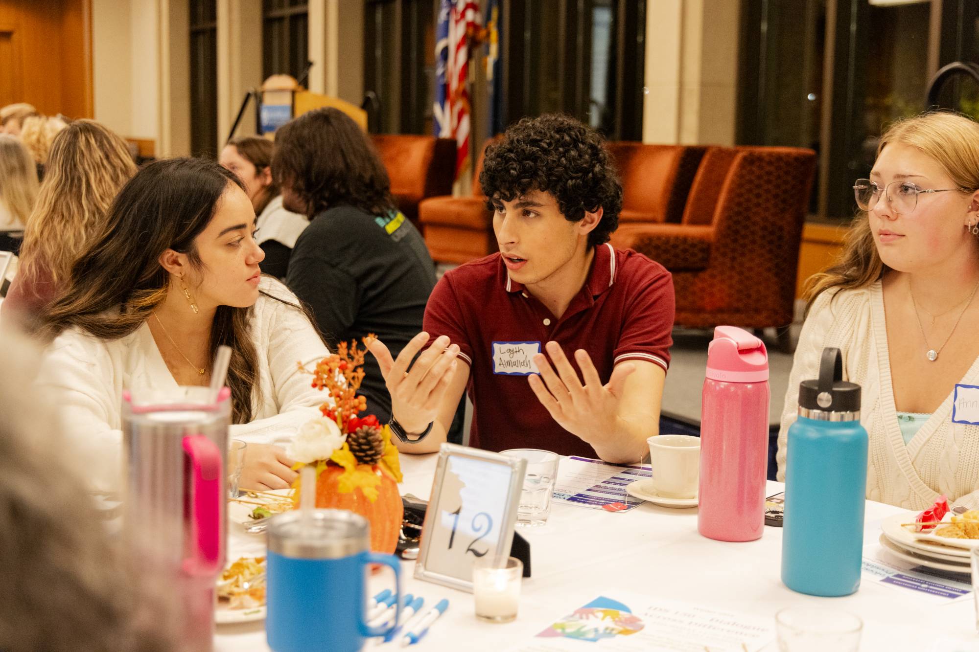 A table of attendees in deep conversation